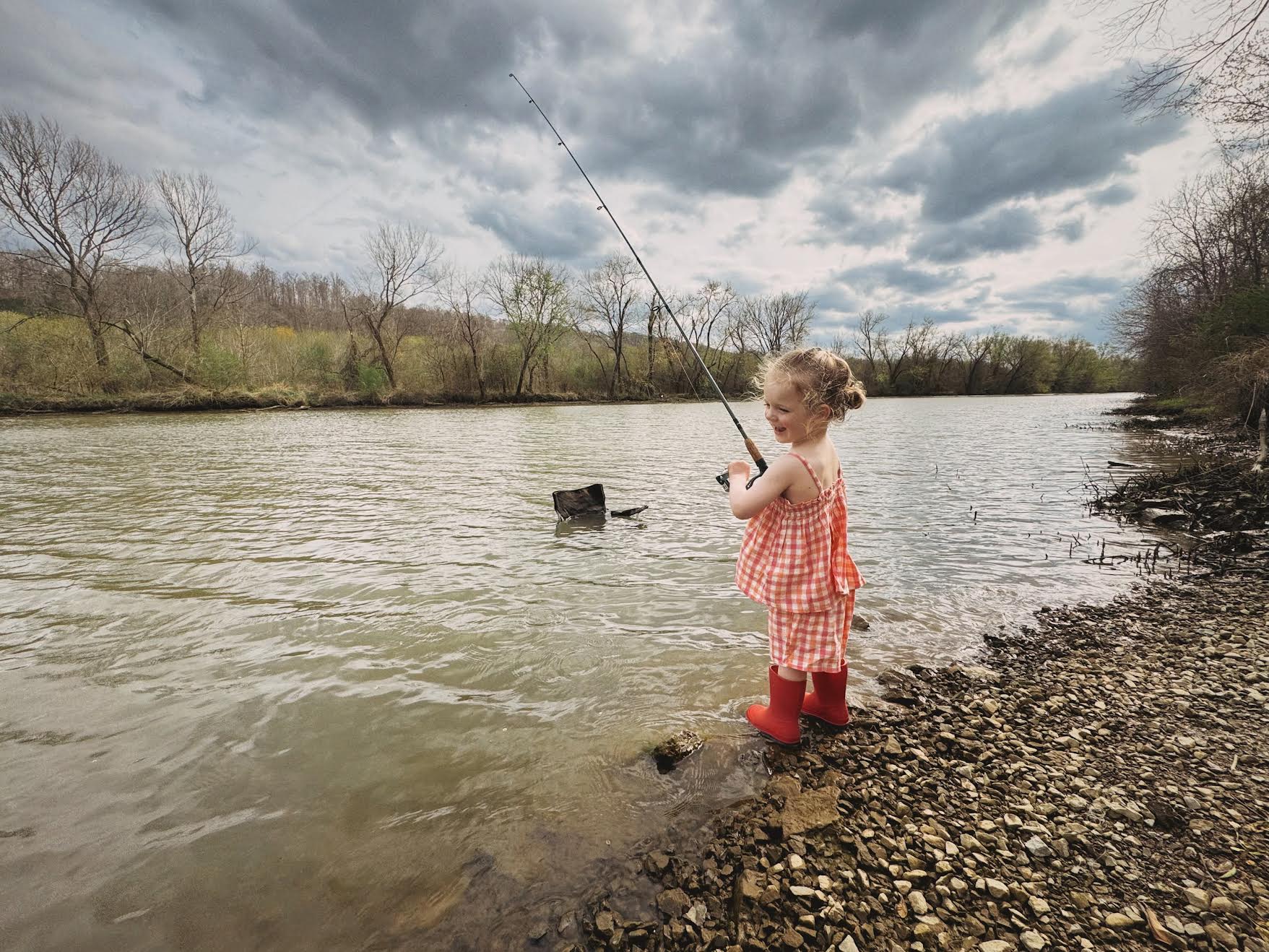 Our daughter Velvet fishing near the Harpeth RIver, in Tennessee.